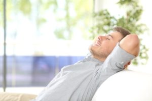 Man resting and breathing at home